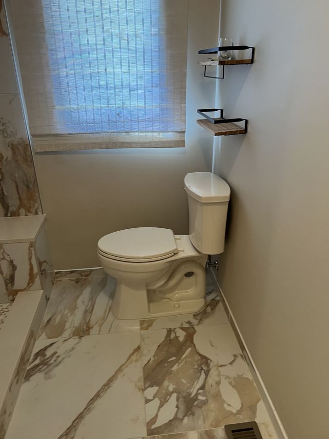 New toilet installed in a remodeled bathroom