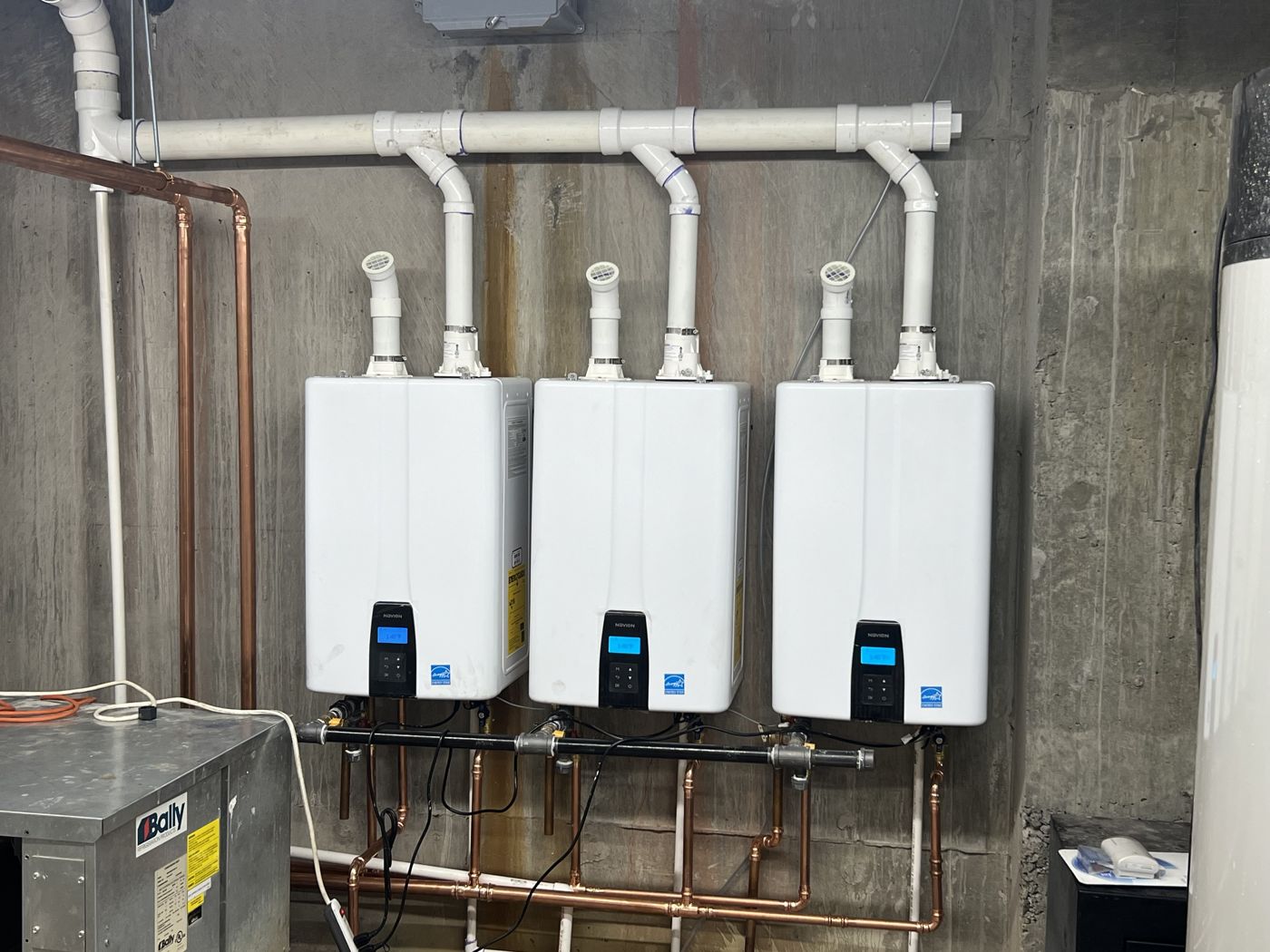 Hotel mechanical room with the finished tankless water heater install