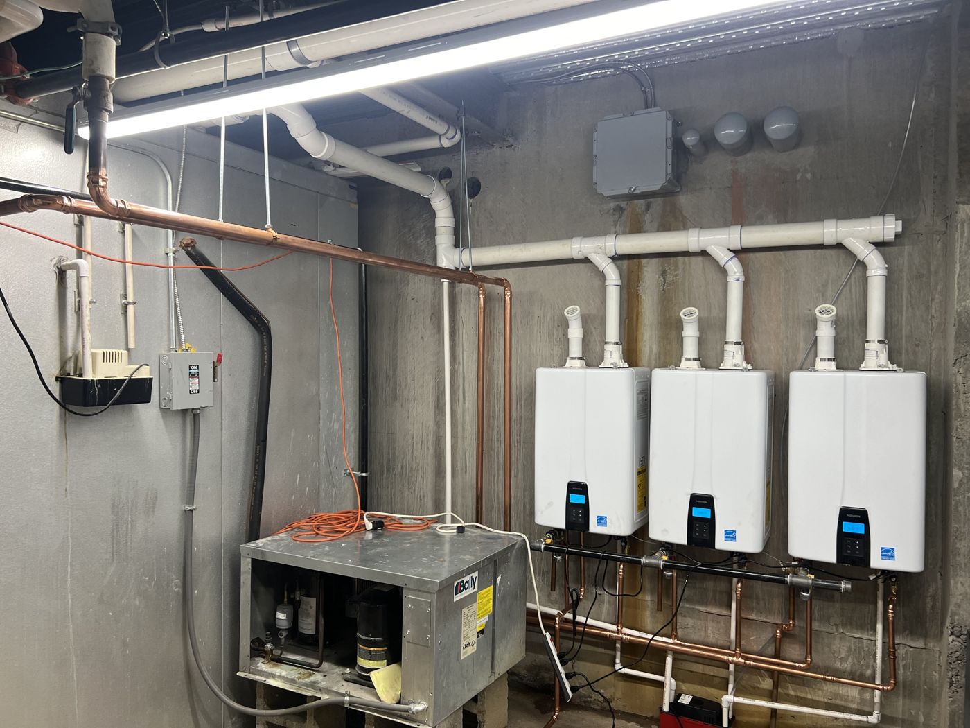 Navien tankless units with PVC venting, gas manifold and copper piping