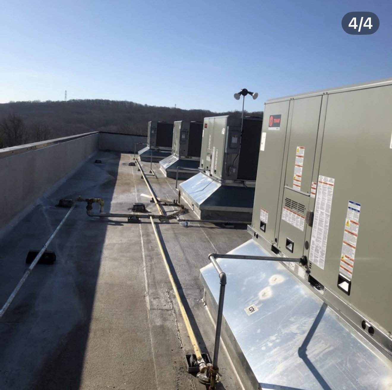 Row of rooftop HVAC units at The Meadow Wood