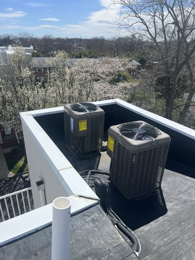 Two new York condensers installed on a rooftop.