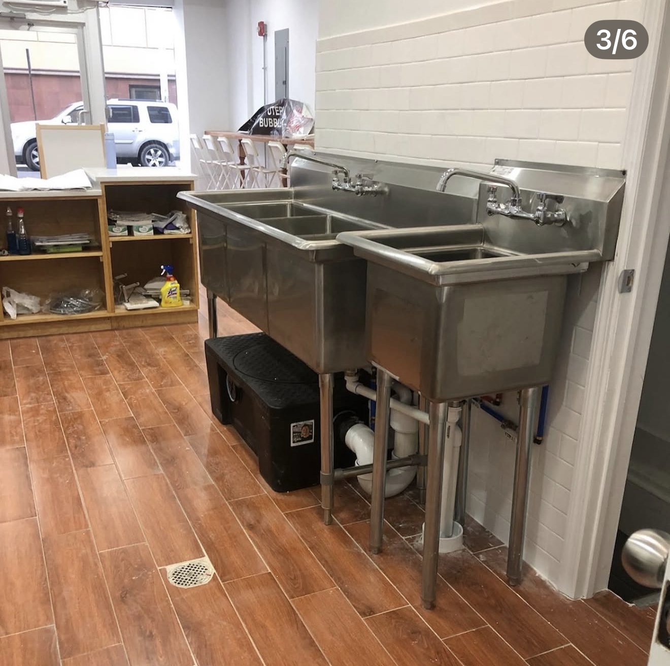 Commercial three-compartment sink and hand sink installed at Utepia Tea